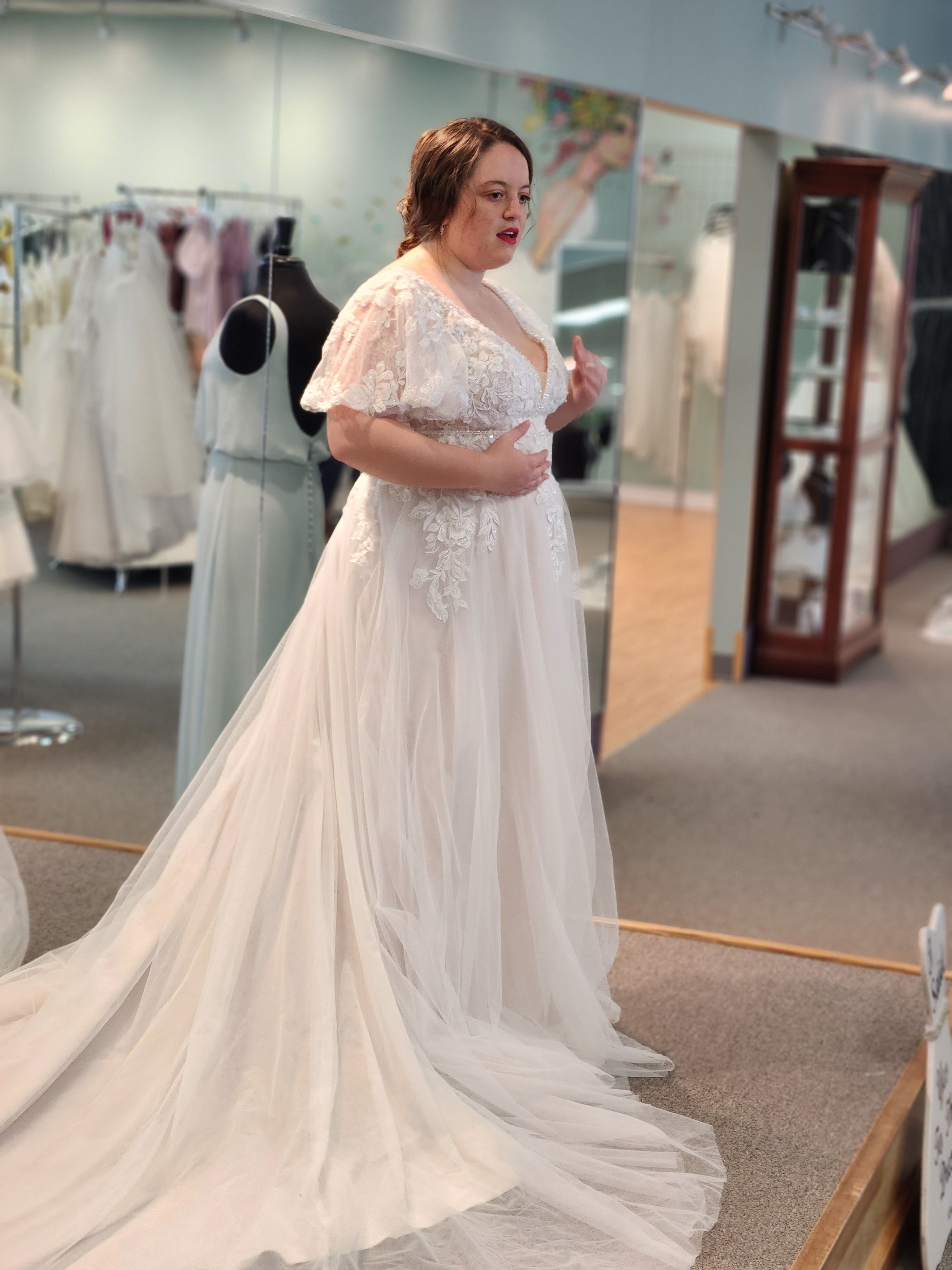 bride trying on dress