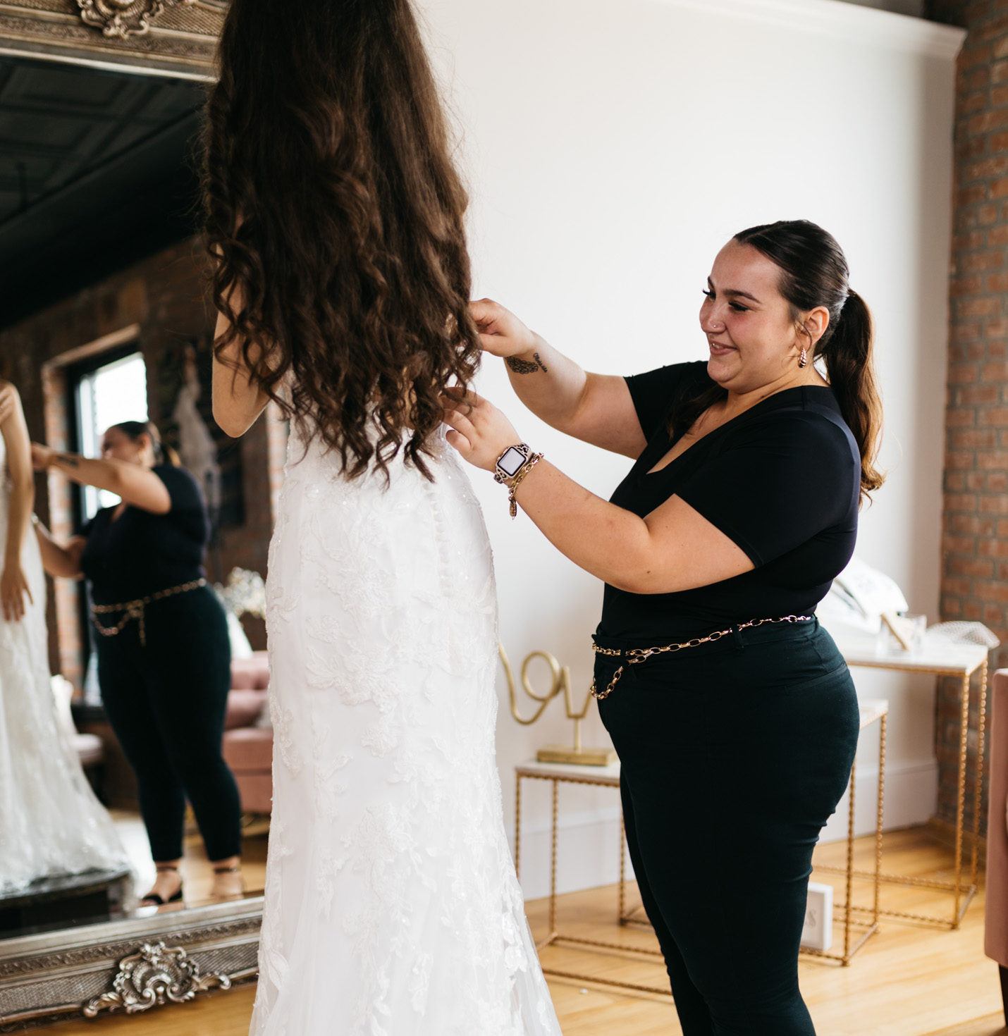 A bride getting her dress altered.