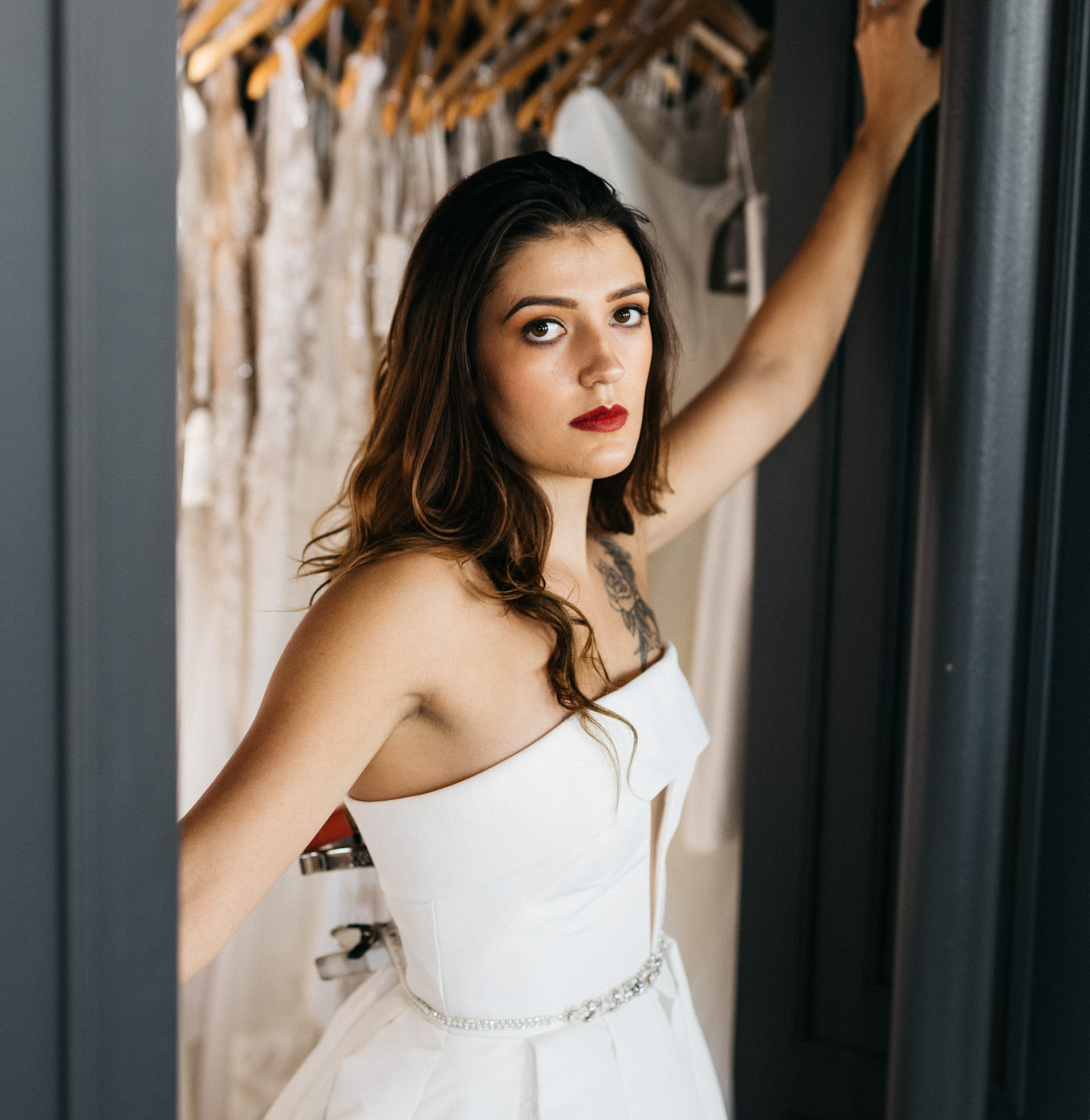 A bride posing for the camera with a serious expression.