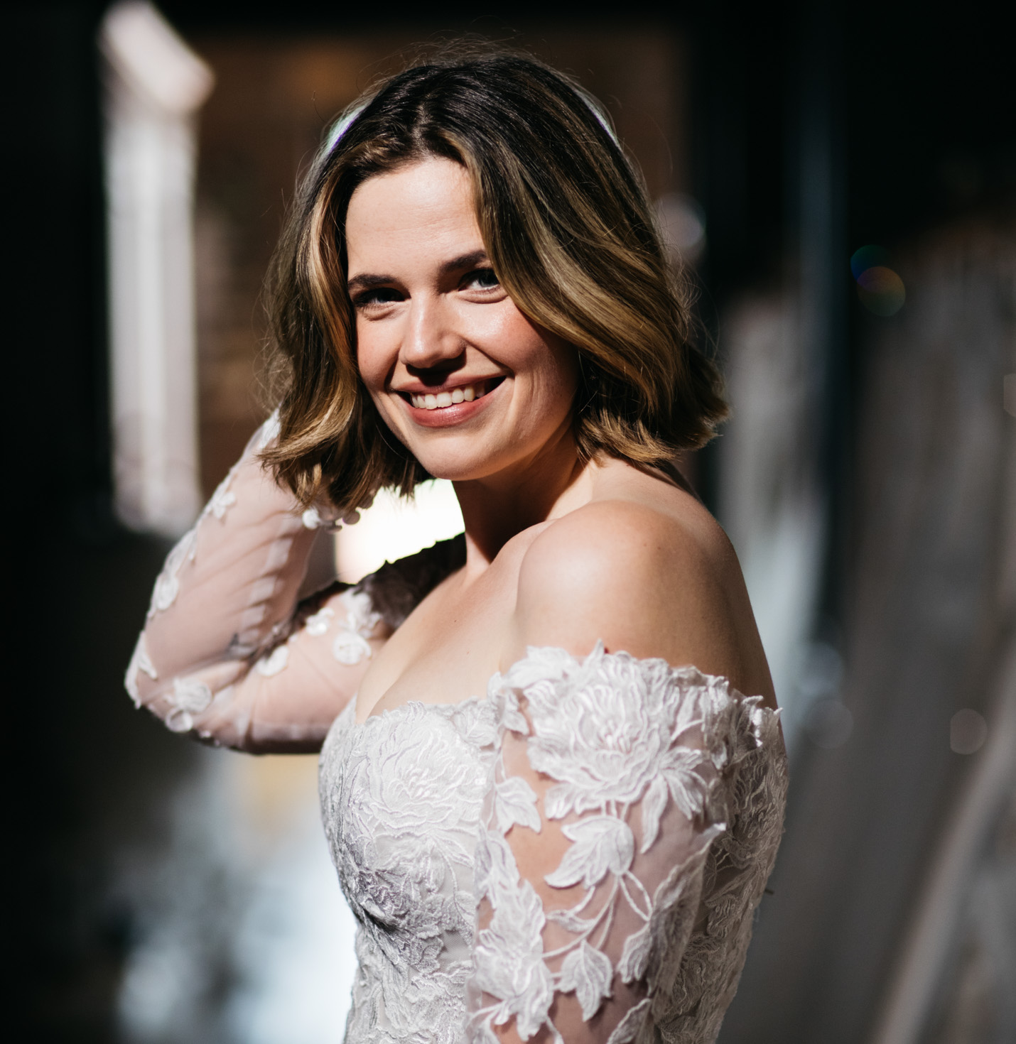 A bride smiling at the camera.