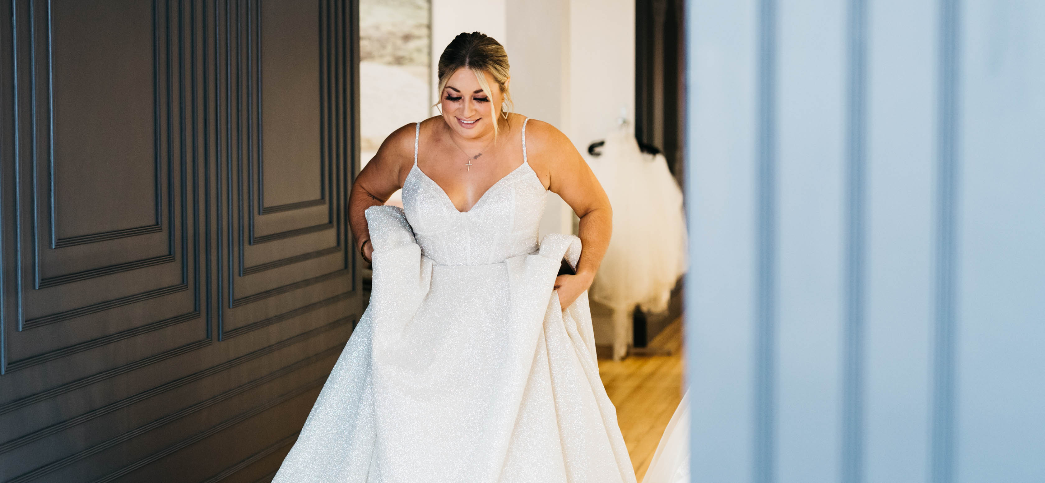 A bride walking in her wedding dress.