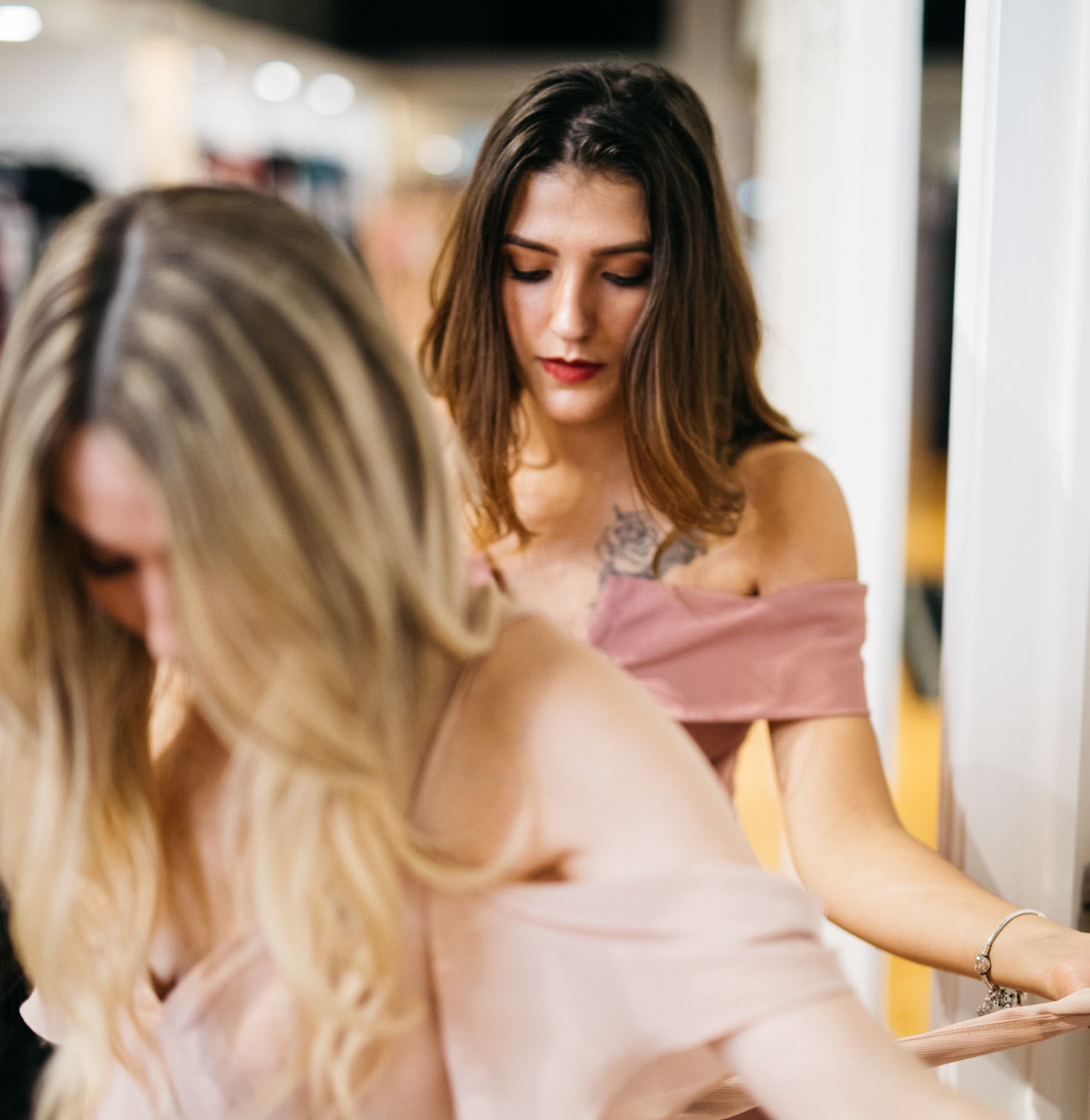 A bridesmaid wearing a dress.