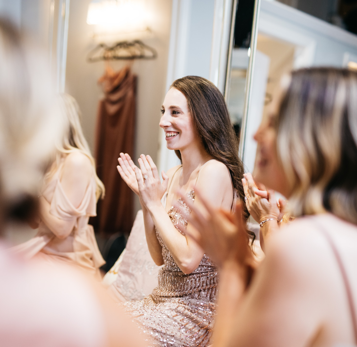 Bridesmaids clapping.