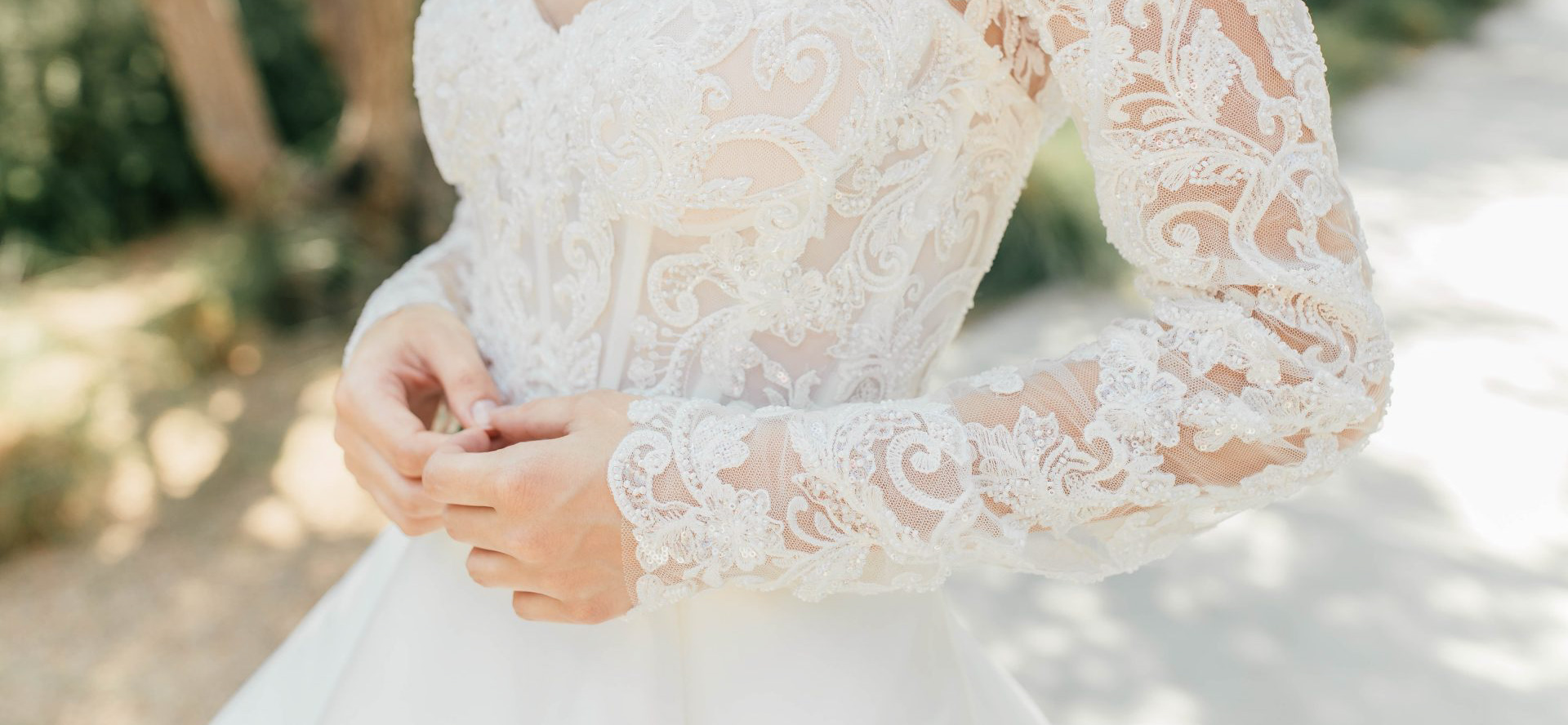 A closeup of a wedding dress.