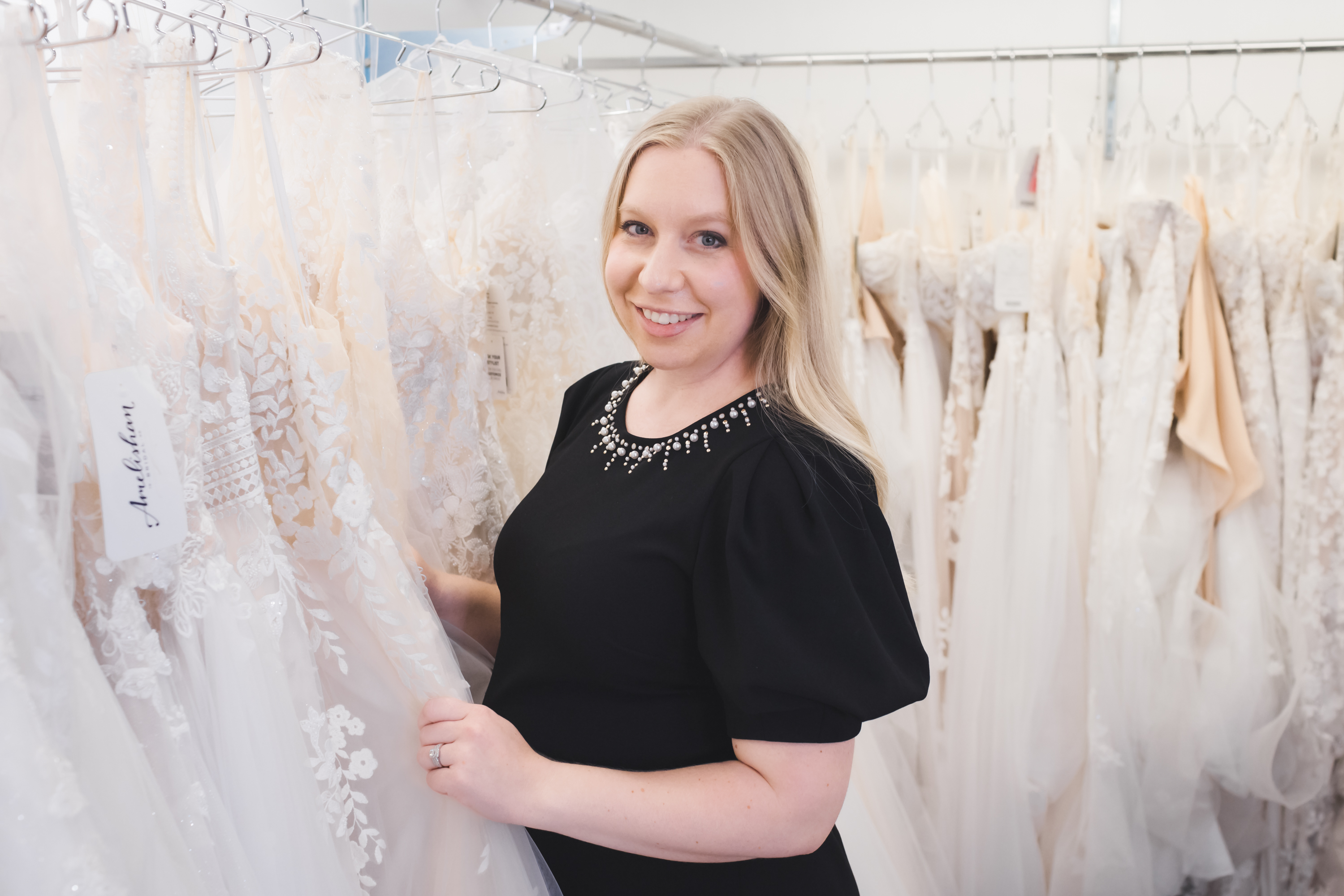 Amelishan Bridal stylist helping a bride choose a wedding dress