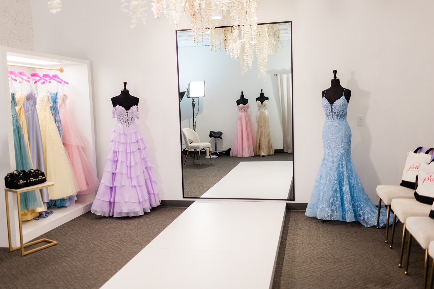 Amelishan Prom fitting area with dresses and mirror