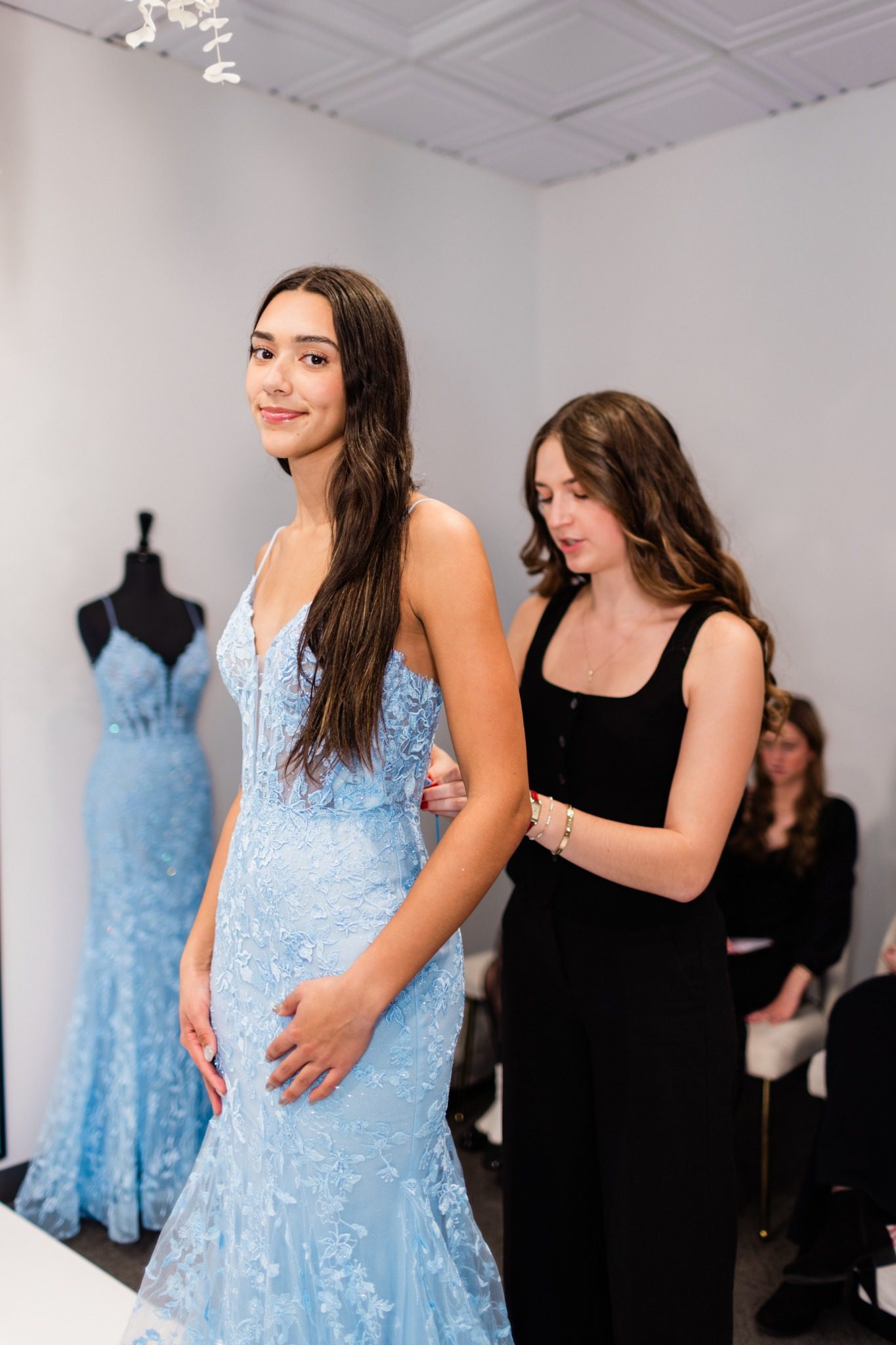 Amelishan Prom stylist helping with a dress fitting